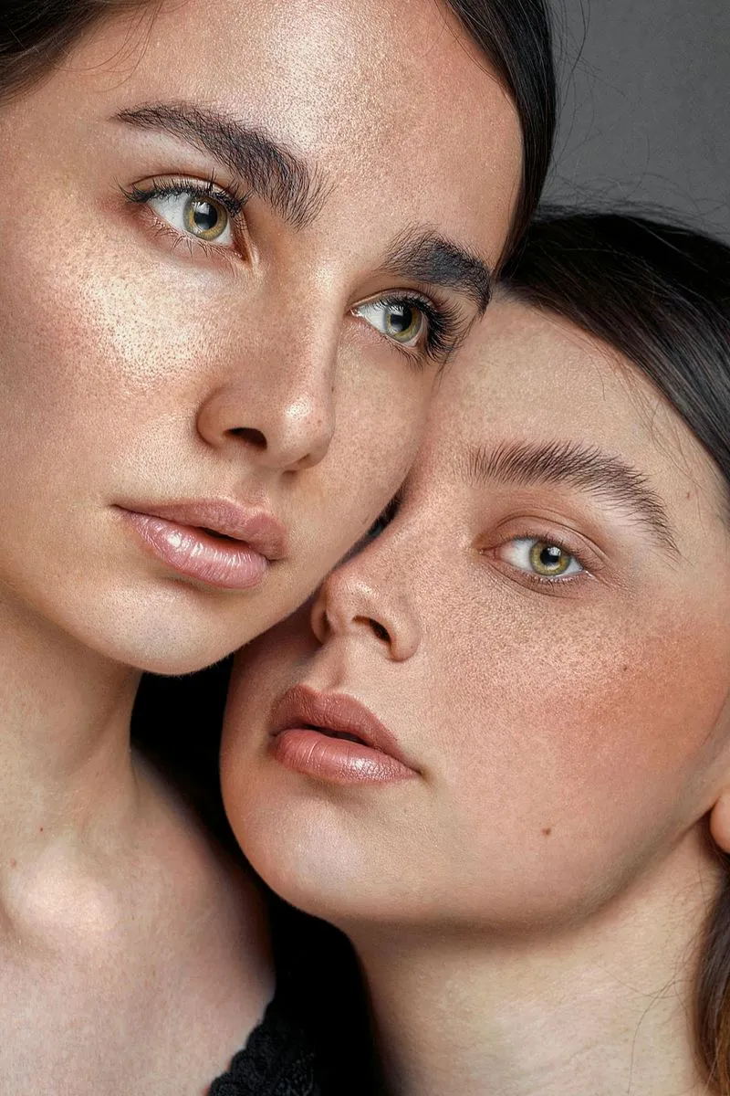 Two women are posing for a picture together.